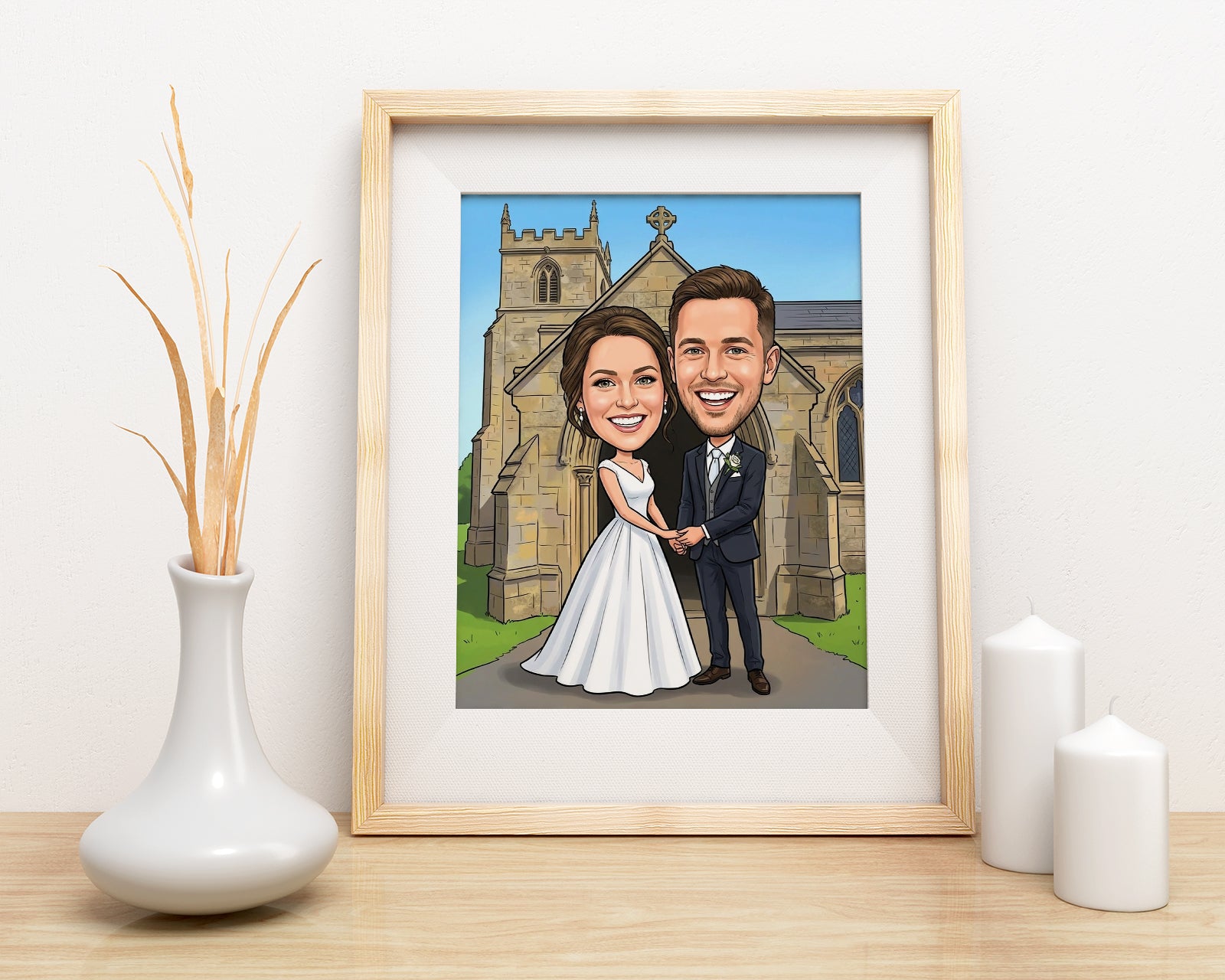 Personalized wedding caricature of smiling bride and groom before church in light wood frame